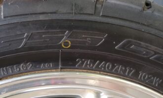 Reading the key specifications stamped onto the rubber of a performance vehicle tire