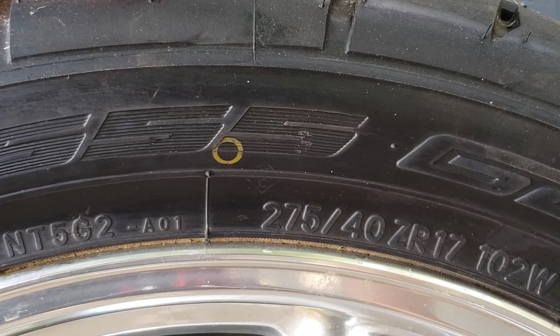 Reading the key specifications stamped onto the rubber of a performance vehicle tire