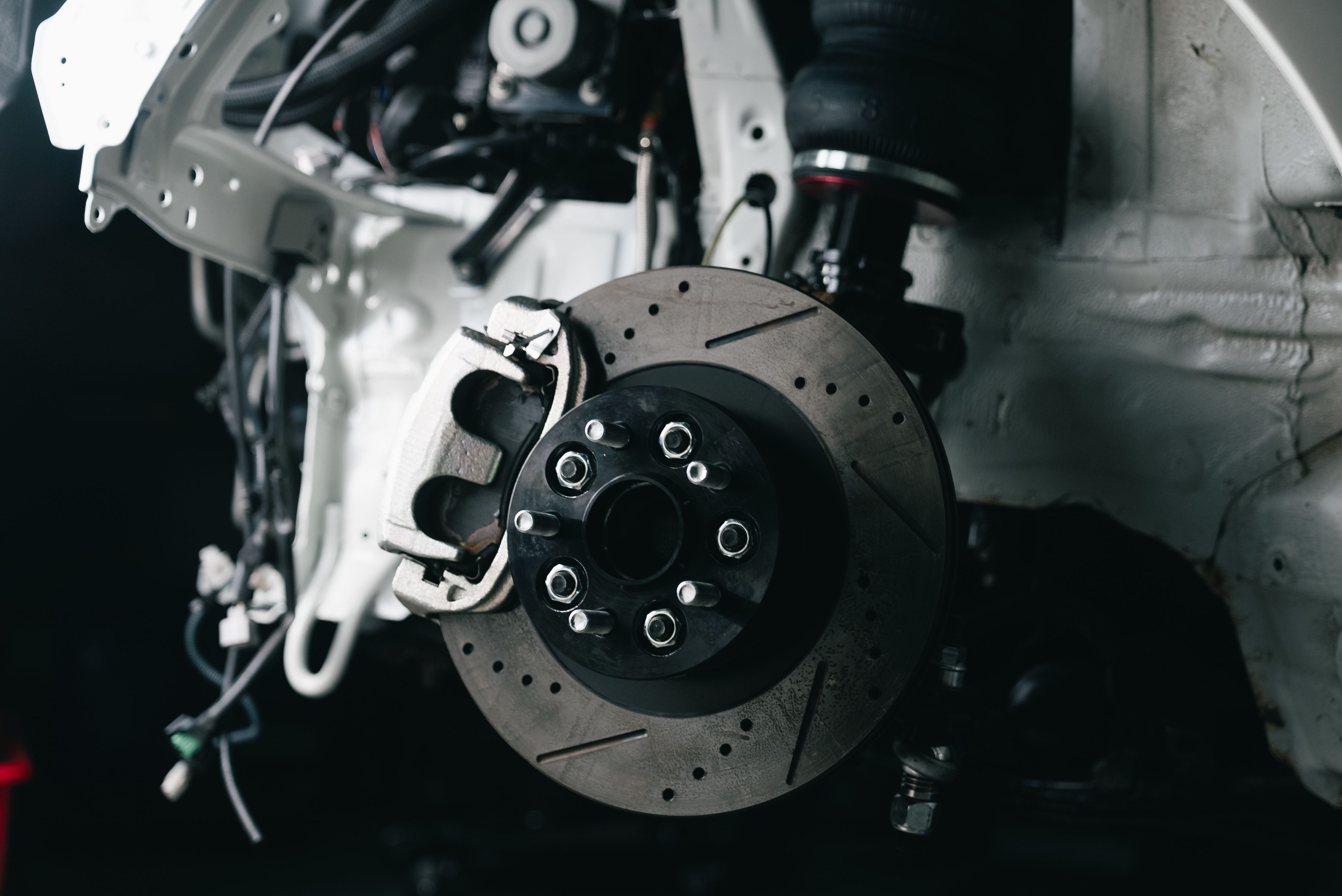 Detailed view of a truck disc brake system with caliper