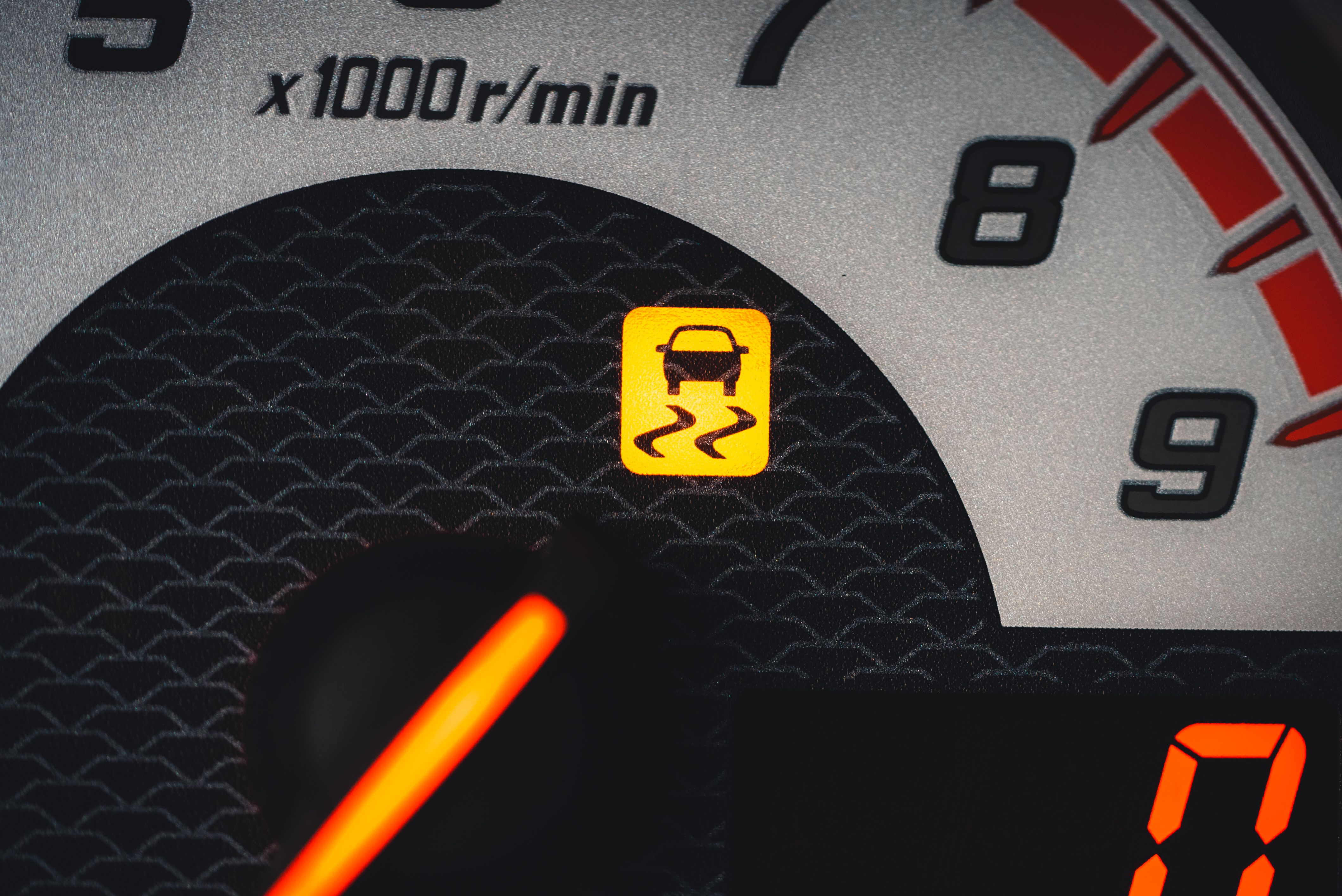 Close-up of a dashboard warning light illuminated